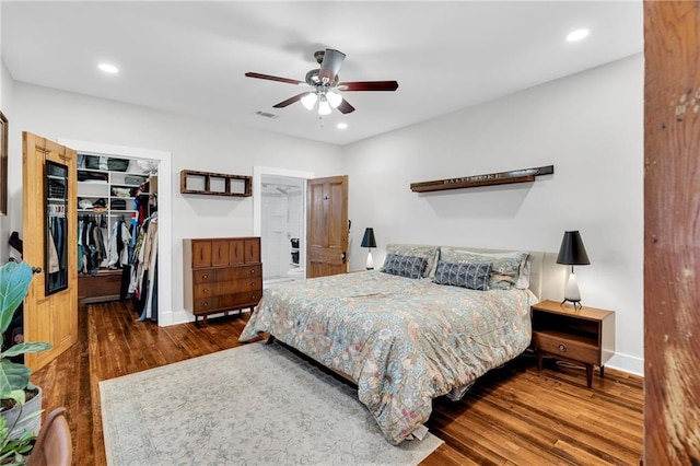 3310 Delachaise St, New Orleans, LA 70125 - bedroom with wood finished floors, a spacious closet, baseboards, a closet, and recessed lighting