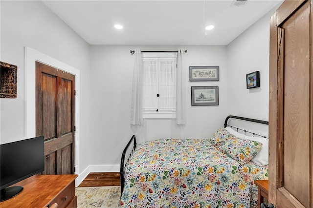 3310 Delachaise St, New Orleans, LA 70125 - bedroom with baseboards, dark wood-style floors, and recessed lighting