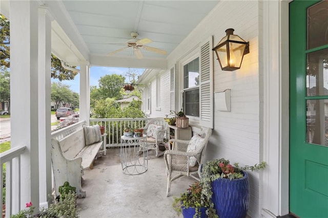 balcony with a porch and a ceiling fan