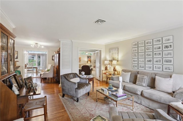 living room featuring crown molding and wood finished floors