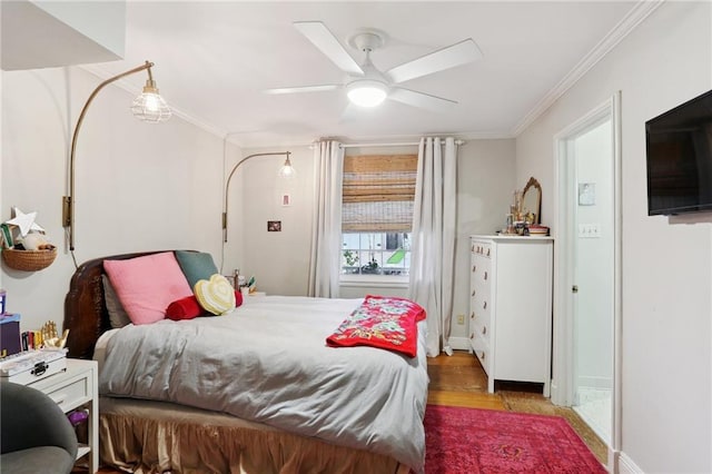 bedroom featuring ornamental molding, wood finished floors, a ceiling fan, and baseboards