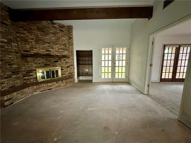 4408 Janice Ave, Metairie, LA 70003 - unfurnished living room featuring french doors, beam ceiling, a brick fireplace, unfinished concrete flooring, and baseboards