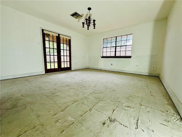 4408 Janice Ave, Metairie, LA 70003 - unfurnished room featuring plenty of natural light, baseboards, and a chandelier