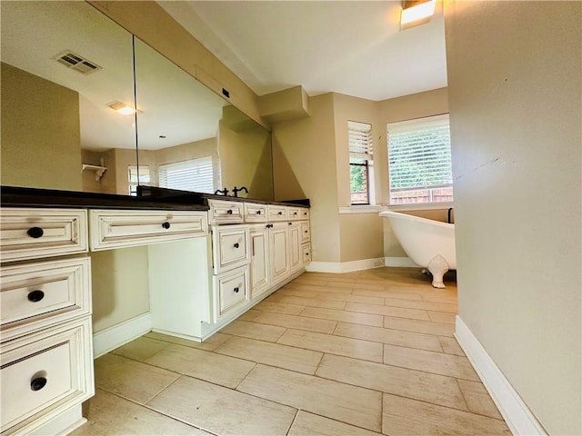 4408 Janice Ave, Metairie, LA 70003 - full bath featuring double vanity, a soaking tub, and tile patterned floors