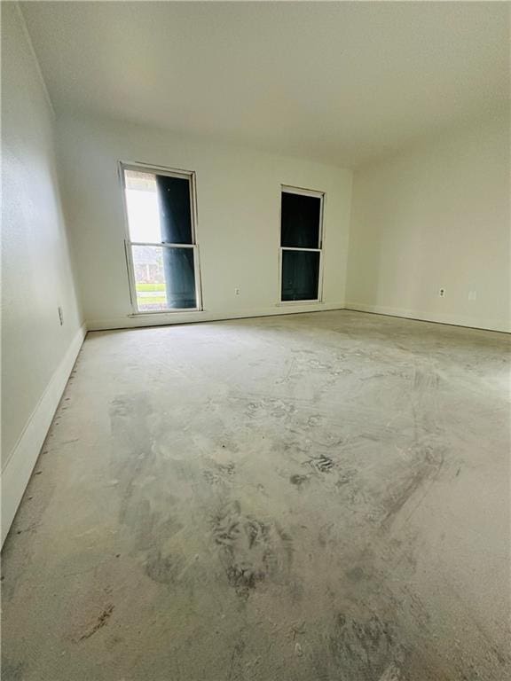 4408 Janice Ave, Metairie, LA 70003 - empty room with concrete floors and baseboards