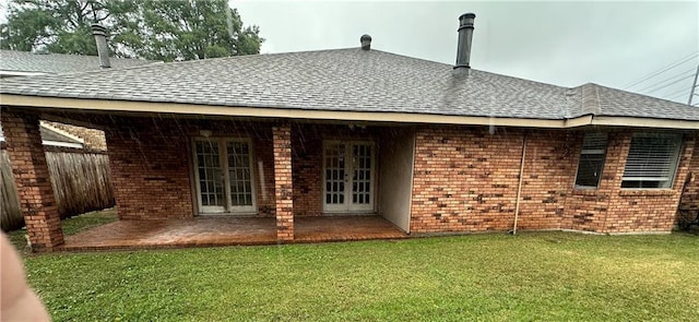 4408 Janice Ave, Metairie, LA 70003 - back of house with french doors, roof with shingles, brick siding, and a patio area