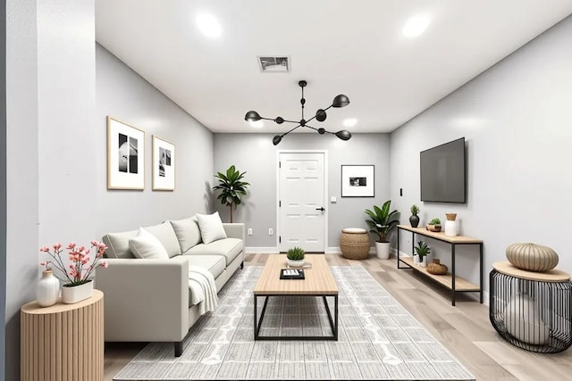 3017 Music St, New Orleans, LA 70122 - living area with a chandelier, light wood finished floors, baseboards, and recessed lighting