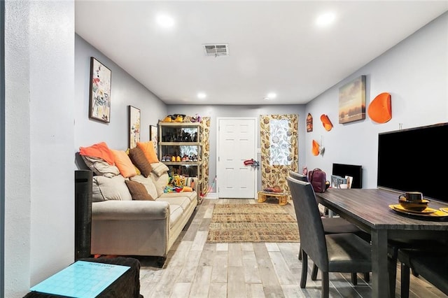 3017 Music St, New Orleans, LA 70122 - living area with light wood-style floors and recessed lighting
