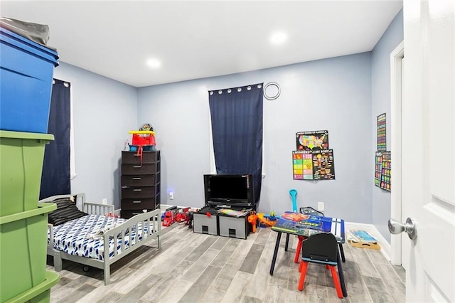 3017 Music St, New Orleans, LA 70122 - bedroom featuring wood finished floors, recessed lighting, and baseboards