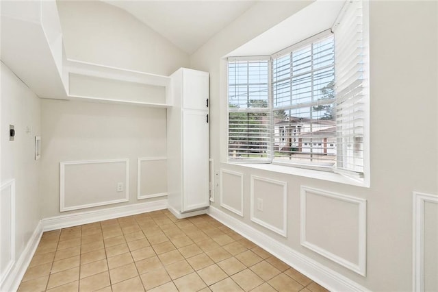838 Jefferson St, Gretna, LA 70053 - doorway with light tile patterned floors and a decorative wall