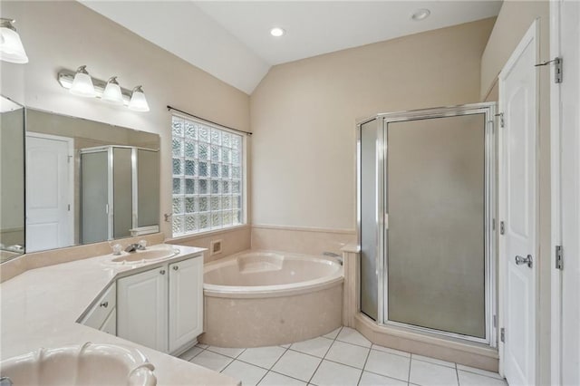 937 Crestwood Dr, Covington, LA 70433 - bathroom featuring vanity, a shower stall, a bath, tile patterned flooring, and vaulted ceiling