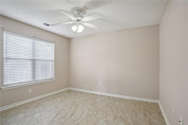 937 Crestwood Dr, Covington, LA 70433 - unfurnished room featuring a textured ceiling, a ceiling fan, and baseboards