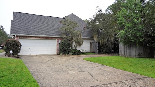 937 Crestwood Dr, Covington, LA 70433 - view of front of property featuring driveway, a shingled roof, brick siding, an attached garage, and a front lawn