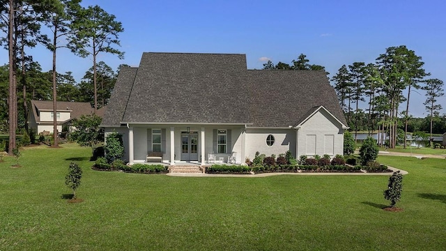 972 Camphill Dr, Abita Springs, LA 70420 - cape cod-style house with covered porch, a front yard, stucco siding, and french doors