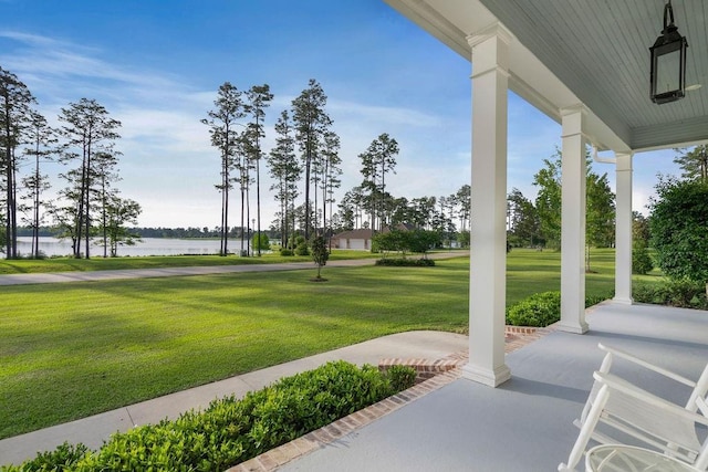 972 Camphill Dr, Abita Springs, LA 70420 - view of patio featuring covered porch and a water view
