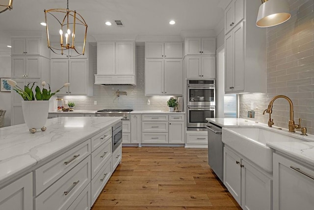 972 Camphill Dr, Abita Springs, LA 70420 - kitchen featuring stainless steel appliances, white cabinetry, backsplash, and recessed lighting