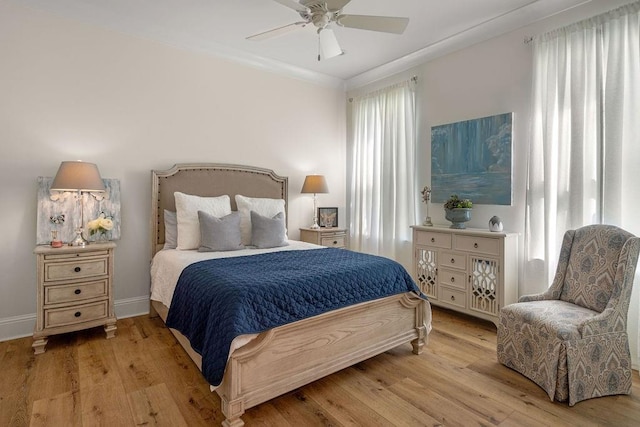 972 Camphill Dr, Abita Springs, LA 70420 - bedroom with wood finished floors, ceiling fan, and ornamental molding
