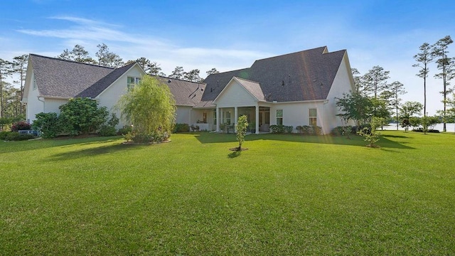 972 Camphill Dr, Abita Springs, LA 70420 - rear view of property featuring a yard, stucco siding, and a shingled roof