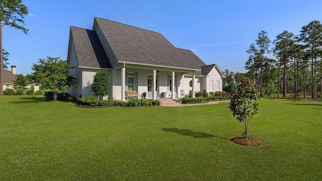 972 Camphill Dr, Abita Springs, LA 70420 - view of front of home featuring a porch, a front lawn, and roof with shingles