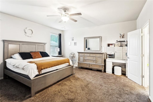 carpeted bedroom with baseboards and a ceiling fan