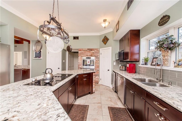 kitchen featuring a sink, stainless steel appliances, tasteful backsplash, ornamental molding, and light stone countertops