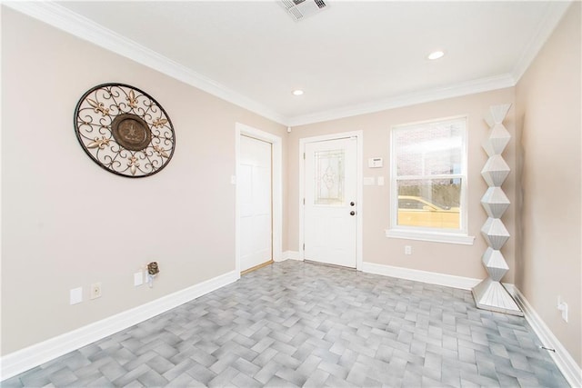 entrance foyer featuring baseboards, crown molding, and recessed lighting