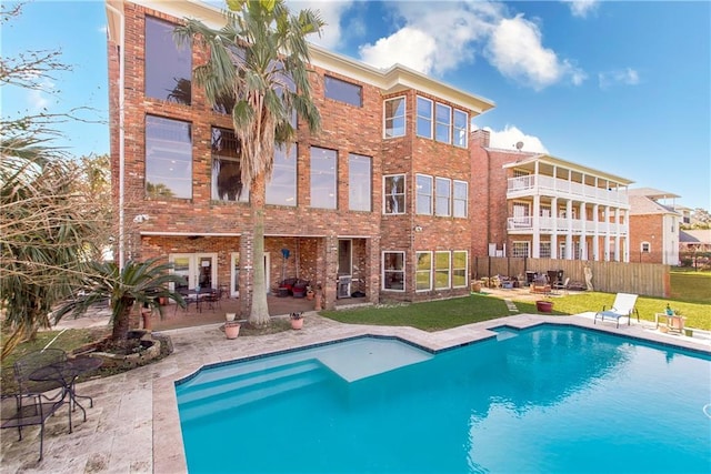 outdoor pool with a patio