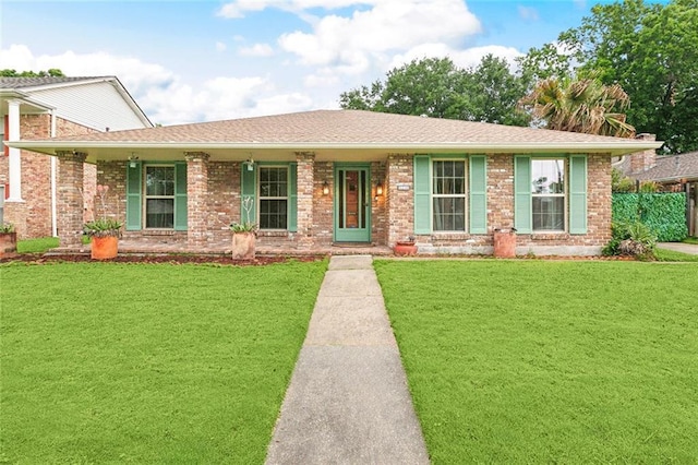ranch-style home featuring a porch, roof with shingles, and brick siding
