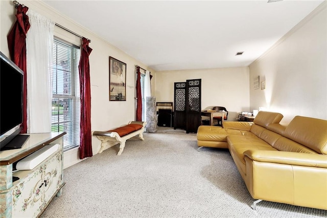 living area featuring carpet floors, plenty of natural light, and ornamental molding