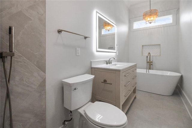 full bathroom featuring toilet, a freestanding bath, vanity, and ornamental molding