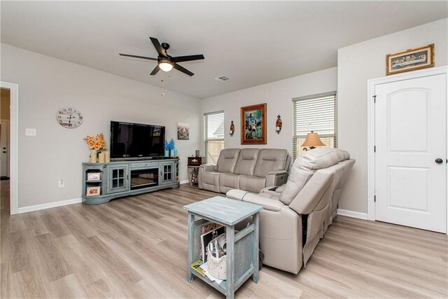 20452 Cornerstone Rd, Hammond, LA 70401 - living area with ceiling fan, light wood-type flooring, and baseboards