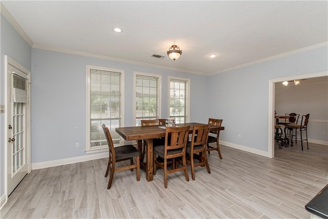 412 Magnolia Ln, Slidell, LA 70461 - dining room with light wood-style flooring, crown molding, baseboards, and recessed lighting