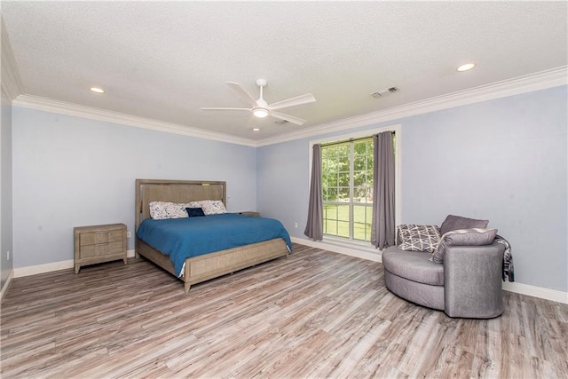 412 Magnolia Ln, Slidell, LA 70461 - bedroom with a textured ceiling, light wood-type flooring, baseboards, crown molding, and recessed lighting