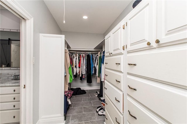 412 Magnolia Ln, Slidell, LA 70461 - spacious closet with dark tile patterned flooring