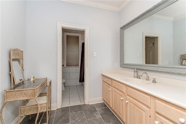 412 Magnolia Ln, Slidell, LA 70461 - bathroom featuring ornamental molding, toilet, vanity, and baseboards