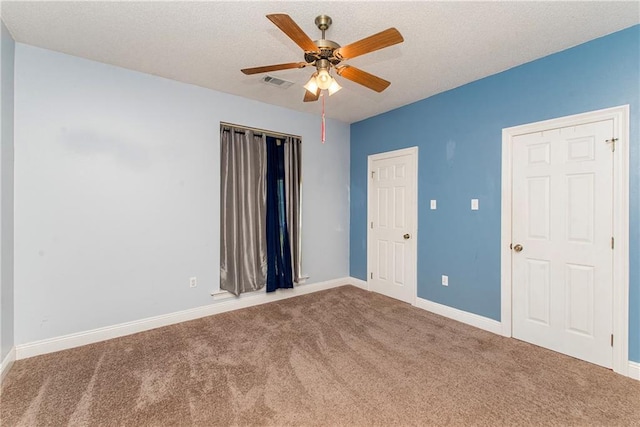 412 Magnolia Ln, Slidell, LA 70461 - carpeted empty room with ceiling fan, baseboards, and a textured ceiling