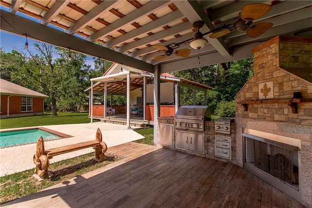 412 Magnolia Ln, Slidell, LA 70461 - view of patio featuring a gazebo, area for grilling, a deck, an outdoor kitchen, and a stone fireplace