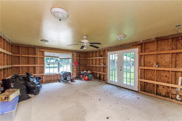 412 Magnolia Ln, Slidell, LA 70461 - miscellaneous room with french doors, wood walls, concrete flooring, and ceiling fan