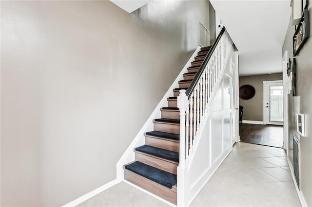 300 Terry Pkwy Unit B, Terrytown, LA 70056 - staircase with tile patterned flooring and baseboards