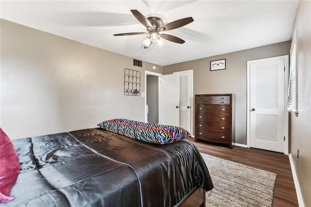 300 Terry Pkwy Unit B, Terrytown, LA 70056 - bedroom featuring wood finished floors, baseboards, ceiling fan, and multiple closets