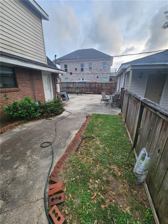 fenced backyard featuring a patio