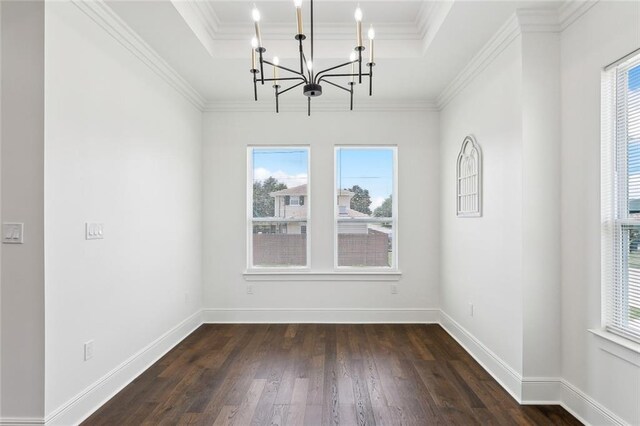 3016 Pecan Dr, Chalmette, LA 70043 - unfurnished dining area featuring a chandelier, a tray ceiling, dark wood-type flooring, baseboards, and ornamental molding