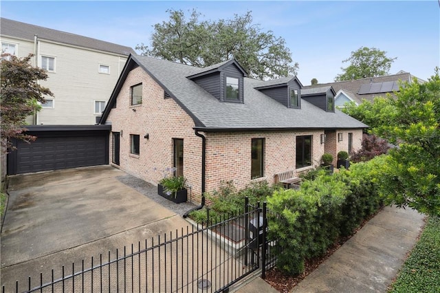 1712 Upperline St, New Orleans, LA 70115 - view of front of home with brick siding, fence, an attached garage, a shingled roof, and driveway