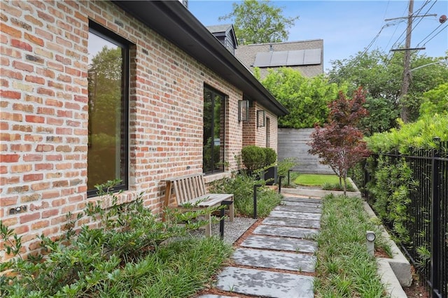 1712 Upperline St, New Orleans, LA 70115 - view of home's exterior featuring brick siding and fence