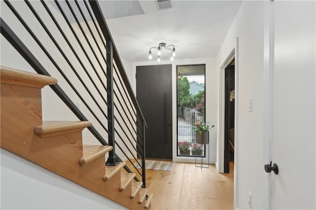 1712 Upperline St, New Orleans, LA 70115 - entrance foyer featuring stairs and light wood-style floors