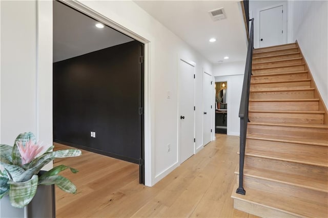 1712 Upperline St, New Orleans, LA 70115 - staircase featuring wood-type flooring, recessed lighting, and baseboards