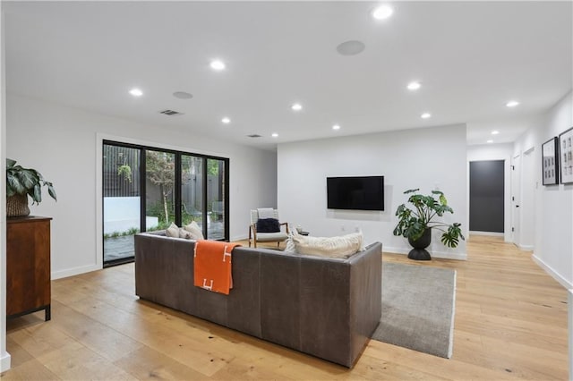 1712 Upperline St, New Orleans, LA 70115 - living room with light wood-style floors, recessed lighting, and baseboards