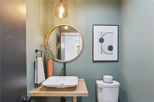 1712 Upperline St, New Orleans, LA 70115 - half bathroom featuring toilet and a sink