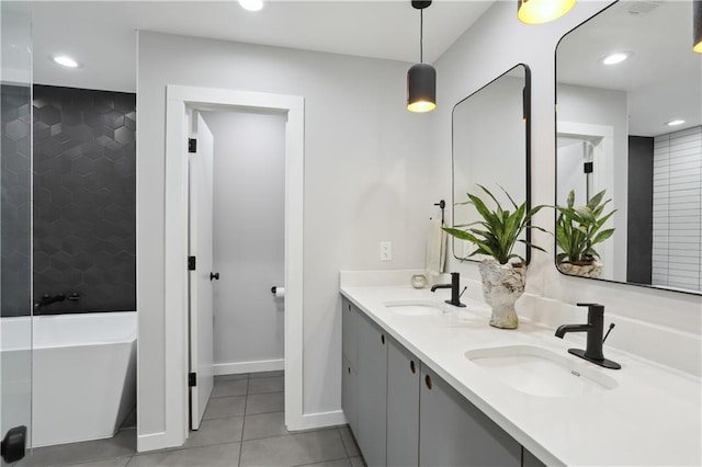 1712 Upperline St, New Orleans, LA 70115 - full bathroom with tile patterned floors, a soaking tub, double vanity, baseboards, and recessed lighting