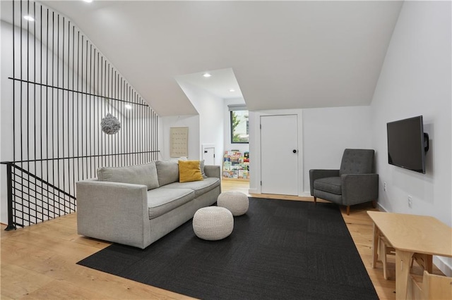 1712 Upperline St, New Orleans, LA 70115 - living room featuring wood finished floors, lofted ceiling, and recessed lighting